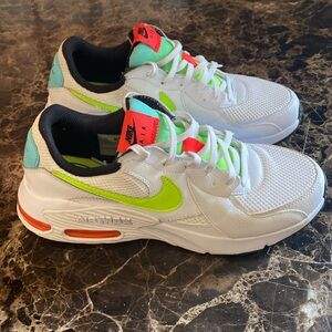 Nike White Sneakers with Neon Green Swoosh and Orange Accents